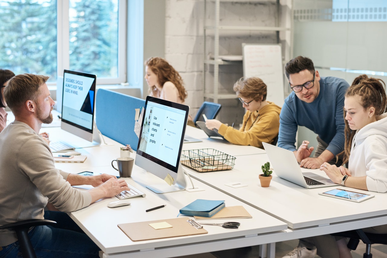 people working in a busy office